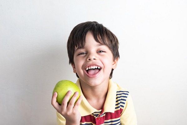 role of nutrition -child-eating-green-apple